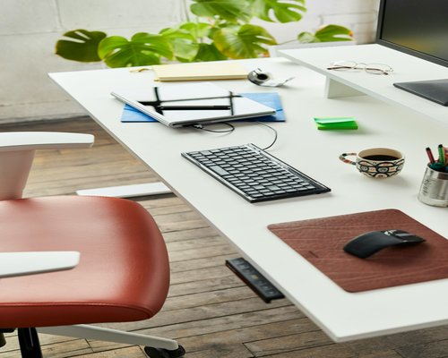 A well-organized modern desk space indicating comfortable working posture